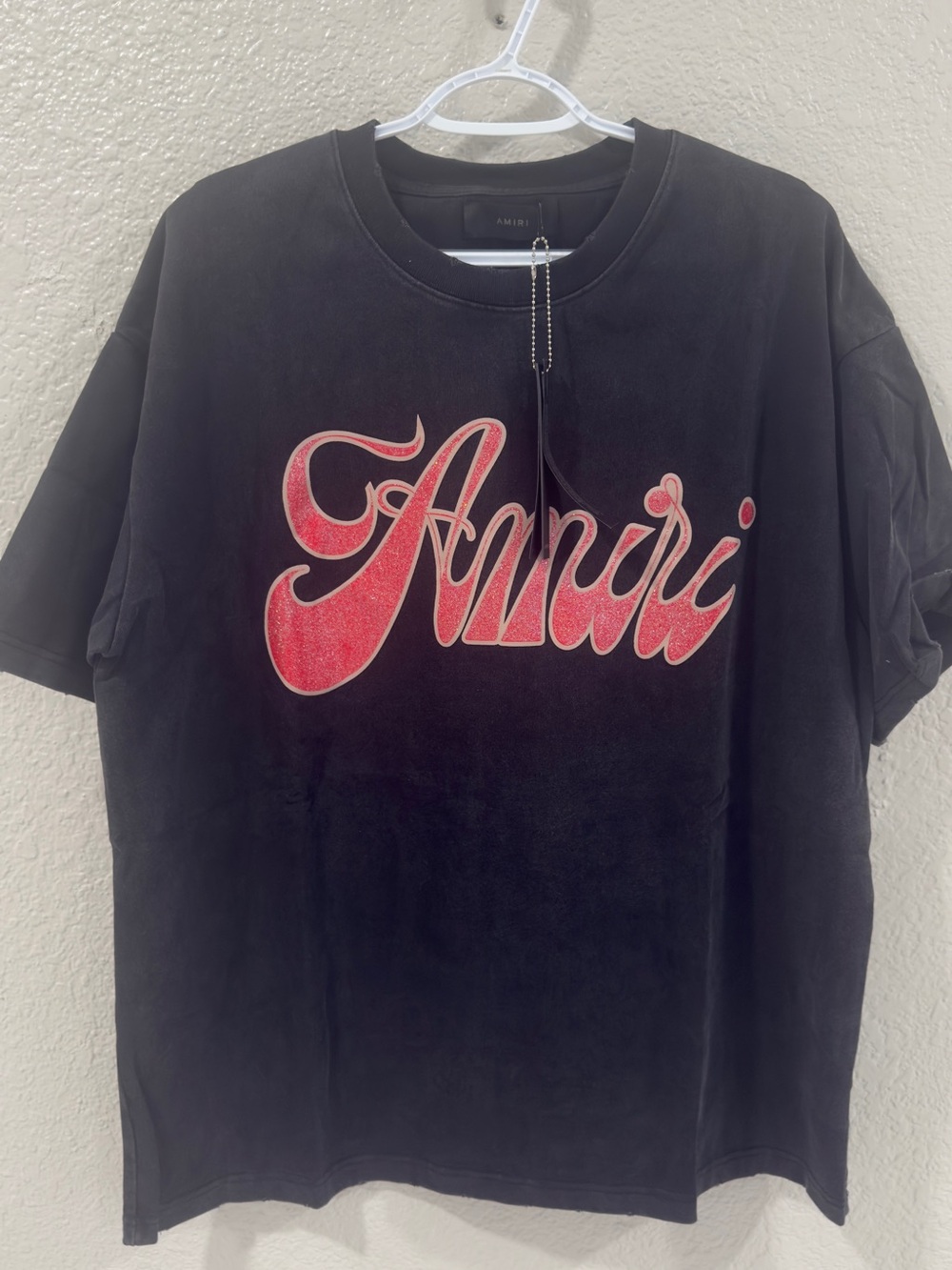 AMIRI Black Tee with Pink Script Graphic